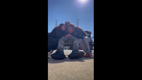 Two black thots sucking dick on a bench on main street