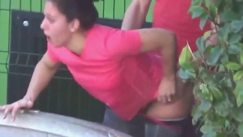 White couple caught fucking doggystyle behind the containers outside