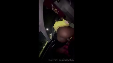 Car head at midnight with a thick black chick riding in the dark